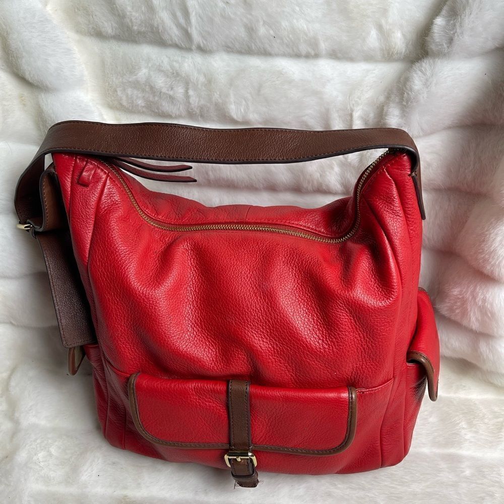 Isaac Mizrahi leather blood orange red shoulder bag with brown trims.